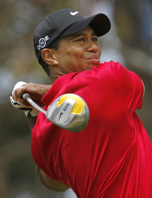 Tiger Woods watches his drive from the second tee during the fourth round of the U.S. Open golf championship at Torrey Pines in San Diego June 15, 2008.