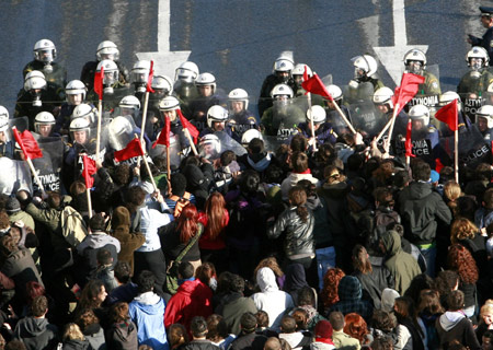  Protesters clash with a formation of police outside the parliament in central Athens December 18, 2008. 