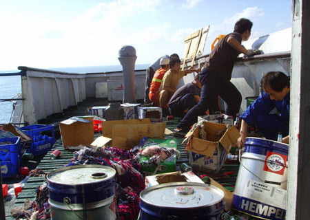 Sailors defend from pirates' attacks on the deck of the Chinese ship 'Zhenhua 4' in the Gulf of Aden, on Dec. 17, 2008. 