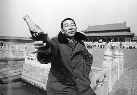 1981, a youth brandishes a bottle of Coca-Cola in the Forbidden City. Ever since Deng Xiaoping's opening up and reform policy, China has been riding an economic boom, attracting huge investment from abroad. Coca-Cola, which was first sold in China in the 1920s, set up its first plant in Beijing in 1980. 