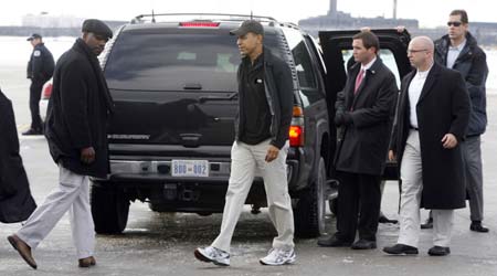 U.S. President-elect Barack Obama gets out of his SUV before boarding a plane for a 12-day Hawaii vacation at O'Hare airport in Chicago, December 20, 2008.