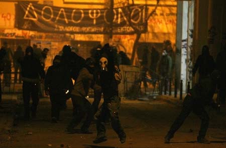 Demonstrators clash with police during riots outside the Athens Polytechnic Dec. 20, 2008. Greek demonstrators threw petrol bombs at finance ministry offices and torched two cars in central Athens on Saturday as anti-government protests entered a third week since police shot dead a teenager. 