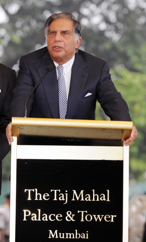 Rotan.Tata, owner of Taj Mahal hotel, addresses press outside the reopening hotel in Mumbai, India, on Dec. 21, 2008. The first batch of guests checked back into the Taj Mahal Place and Tower on Sunday after three weeks of refurbishment work. 