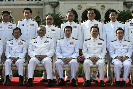 Members of Thailand's new cabinet take a group photo at the Government House in Bangkok December 22, 2008. New Thai Prime Minister Abhisit Vejjajiva unveiled a cabinet on Saturday including several ministers criticised for lack of experience and a foreign minister closely tied to this year's street protests. 