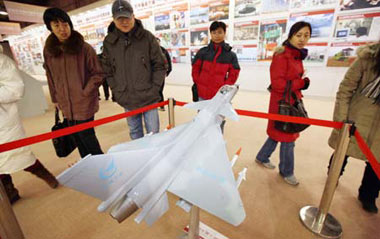 Visitors are seen at the exhibition commemorating the 30th anniversary of China's reform and opening up, held in Beijing, capital of China, on Dec. 22, 2008. The exhibition that began on Dec.18, attracted many visitors.