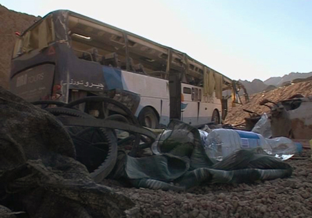 A video grab shows the wreckage of a bus sits by the side of the road after it overturned between two Egyptian resorts in the Sinai peninsula December 22, 2008. 