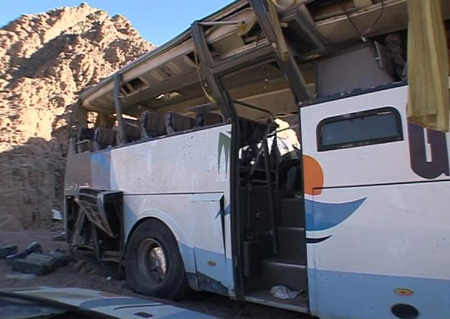 A video grab shows the wreckage of a bus sits by the side of the road after it overturned between two Egyptian resorts in the Sinai peninsula December 22, 2008.