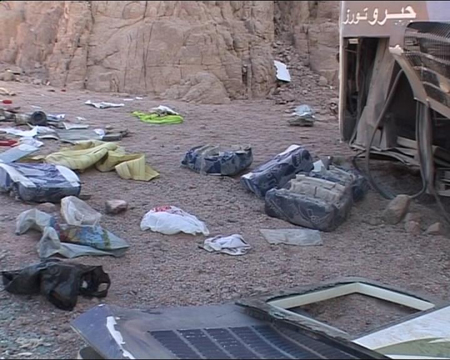 A video grab shows the wreckage and the belongings scattered on the ground after a tour bus overturned between two Egyptian resorts in the Sinai peninsula December 22, 2008. 