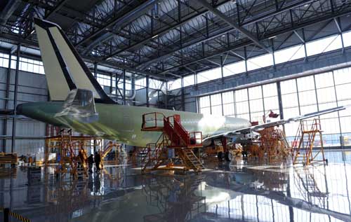 An Airbus A320 is being assembled at the general assemble workshop in north China's Tianjin municipality, on Dec. 23, 2008, with three other Airbus A320 also in the process of assembling at the same time. It is estimated that the first plane will be painted in early 2009. 