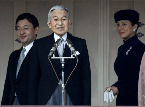 Japan's Emperor Akihito, Crown Prince Naruhito (L) and Crown Princes Masako (R) appear before well-wishers as they celebrate the emperor's 75th birthday at the Imperial Palace in Tokyo December 23, 2008. 