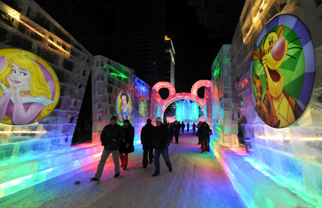 Visitors walk along a section of a Disney-themed ice sculpture. The trial run of Harbin Disney ice festival kicked off in Harbin, capital of northeast China's Heilongjiang province, December 22, 2008. As part of the 'Ice and Snow Fairytale World', 10 Disney-themed ice sculptures are on show and 16 entertainment areas are available at no charge during the event.[Xinhua]