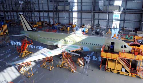 An Airbus A320 is assembled at the workshop in north China&apos;s Tianjin municipality, on Dec. 23, 2008, with three other Airbus A320 also in the process of assembling at the same time. It is estimated that the first plane will be painted in early 2009.