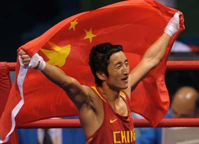 Zou Shiming of China celebrates victory after Men's Light Fly(48kg) Final Bout against Serdamba Purevdorj of Mongolia at Beijing 2008 Olympic Games boxing event at Workers' Gymnasium in Beijing. Zou Shiming won the gold medal of the event.[Xinhua] 