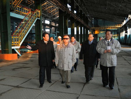 Kim Jong Il (L2, front), top leader of the Democratic People's Republic of Korea, inspects a steel-making enterprise in south pyong'an-do in DPRK in this picture released by Korean Central News Agency of DPRK.[Xinhua]