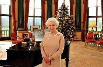 Britain's Queen Elizabeth II stands in the Music Room of Buckingham Palace. 