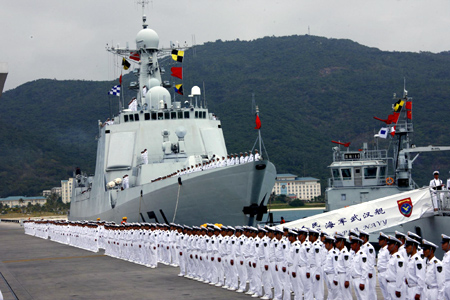 A ceremony is held before a Chinese naval fleet sets sail from a port in Sanya city of China's southernmost island province of Hainan on Dec. 26, 2008. The Chinese naval fleet including two destroyers and a supply ship from the South China Sea Fleet set off on Friday for waters off Somalia for an escort mission against piracy. [Zha Chunming/Xinhua] 