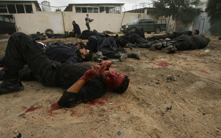Bodies of Palestinian Hamas policemen are scattered on the ground following an Israeli air strike in Gaza City on December 27, 2008. About 200 Palestinians were killed and hundreds wounded in a series of simultaneous Israeli air strikes in Gaza Strip. (Xinhua photo]
