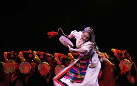 Dancers perform during a party marks the 50th anniversary of the Tibetan Autonomous Region Song and Dance Troupe in Lhasa, capital of west China's Tibetan Autonomous Region, Dec. 28, 2008. 