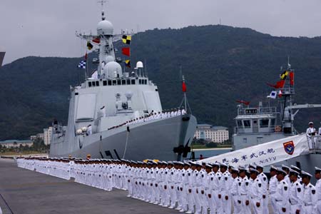 A ceremony is held before a Chinese naval fleet sets sail from a port in Sanya city of China's southernmost island province of Hainan on Dec. 26, 2008. The Chinese naval fleet including two destroyers and a supply ship from the South China Sea Fleet set off on Friday for waters off Somalia for an escort mission against piracy.[Zha Chunming/Xinhua]