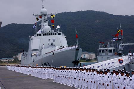 A ceremony is held before a Chinese naval fleet sets sail from a port in Sanya city of China's southernmost island province of Hainan on Dec. 26, 2008. The Chinese naval fleet including two destroyers and a supply ship from the South China Sea Fleet set off on Friday for waters off Somalia for an escort mission against piracy.[Zha Chunming/Xinhua] 