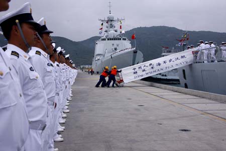 A ceremony is held before a Chinese naval fleet sets sail from a port in Sanya City of China's southernmost island province of Hainan on Dec. 26, 2008. The Chinese naval fleet including two destroyers and a supply ship from the South China Sea Fleet set off on Friday for waters off Somalia for an escort mission against piracy.[Zha Chunming/Xinhua] 