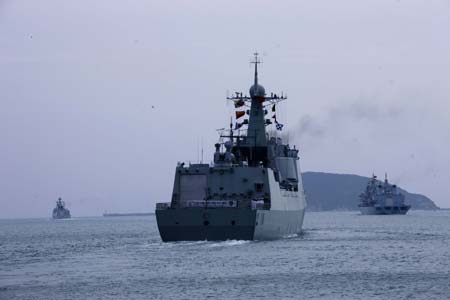  The Chinese naval fleet including two destroyers and a supply ship from the South China Sea Fleet set off from Sanya, a coastal city of South China's Hainan Province for waters off Somalia for an escort mission against piracy Dec. 26, 2008. [Zha Chunming/Xinhua] 