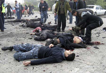 Bodies of Hamas policemen lie on the ground of their destroyed police compound following an Israeli air strike in Gaza December 27, 2008. Israeli air strikes in the Hamas-ruled Gaza Strip on Saturday killed at least 271 Palestinians, health officials in Gaza said. [Xinhua]