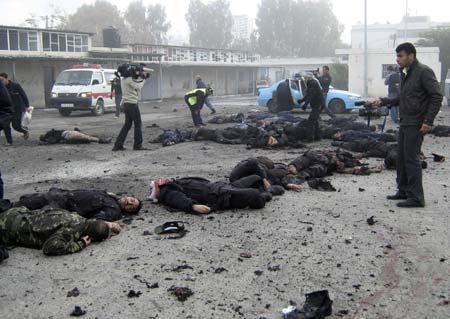 Bodies of Hamas policemen lie on the ground of their destroyed police compound following an Israeli air strike in Gaza December 27, 2008. Israeli air strikes in the Hamas-ruled Gaza Strip on Saturday killed at least 271 Palestinians, health officials in Gaza said. [Xinhua/Reuters]