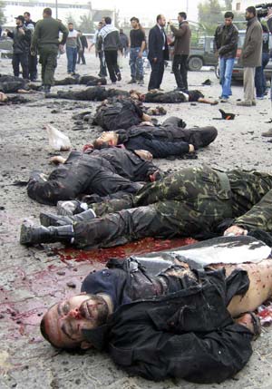 Bodies of Hamas policemen lie on the ground of their destroyed police compound following an Israeli air strike in Gaza December 27, 2008. Israeli warplanes and helicopters pounded the Hamas-ruled Gaza Strip on Saturday, killing at least 271 people in one of the bloodiest days in the Palestinians' conflict with Israel.[Xinhua/Reuters]