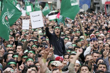 Protesters shout anti-Israel and anti-U.S. slogans during a demonstration against Israeli air strikes in the Gaza Strip in Amman December 27, 2008. Israeli warplanes and helicopters pounded the Hamas-ruled Gaza Strip on Saturday, killing at least 195 people in one of the bloodiest days in the Palestinians' conflict with Israel.[Xinhua/Reuters]