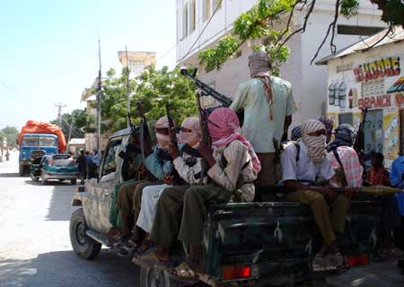 Fighters of Islamist Al-Shabaab movement, a major rebel group in Somalia, patrol on a battle wagon in Mogadishu, captial of Somalia, Dec. 27, 2008. [Xinhua]