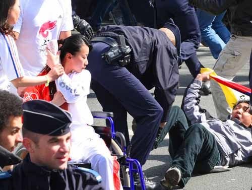 Jin Jing, 27, known as the 'Smiling Angel in a Wheelchair' by her friends, is herself an athlete, a fencer. She was supposed to be the third torchbearer on the Paris route, but the plan was changed because of the chaotic protests. The torch was eventually passed to her on the banks of the Seine River.