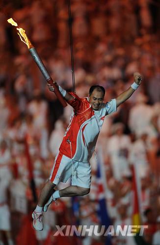 The Olympic flame's four-month-long Journey of Harmony culminated with a spectacular end to the Opening Ceremony of the Beijing 2008 Olympic Games with the lighting of the cauldron just after midnight as former gymnast Li Ning, lifted into mid-air with wires after he received the Olympic flame, 'ran' along the 500-meter-long brim of the Bird's Nest to reach the gigantic cauldron, which he ignited using the flame from his torch. [Xinhua]