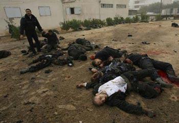 Bodies of Palestinian Hamas policemen are scattered on the ground following an Israeli air strike in Gaza City on December 27, 2008. About 200 Palestinians were killed and hundreds wounded in a series of simultaneous Israeli air strikes in Gaza Strip. [Xinhua/Stringer] 