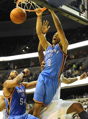 Russell Westbrook (L) of Oklahoma City Thunder dunks during the NBA basket games against Washington Wizards in Washington, the United States, Dec. 27, 2008.