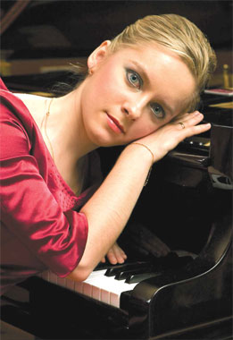 Svetlana Kudryavtseva is nicknamed 'Red Kuva' by her students as she always goes to piano class in formal red dress.