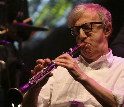U.S. film director and actor Woody Allen plays clarinet during a concert of his New Orleans Jazz Band in Warsaw Poland, , Sunday, Dec. 28, 2008.