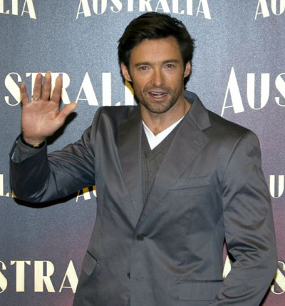 Actor Hugh Jackman waves during a photocall to promote his lastest film 'Australia' in Madrid December 3, 2008. 