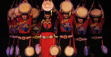 Dancers perform during a party marks the 50th anniversary of the Tibetan Autonomous Region Song and Dance Troupe in Lhasa, capital of west China's Tibetan Autonomous Region, Dec. 28, 2008. 