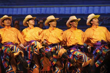 Dancers perform during a party marks the 50th anniversary of the Tibetan Autonomous Region Song and Dance Troupe in Lhasa, capital of west China's Tibetan Autonomous Region, Dec. 28, 2008.