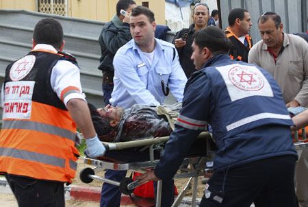 Israeli medics evacuate an injured man from the scene of a rocket attack in the southern city of Ashkelon Dec. 29, 2008. 