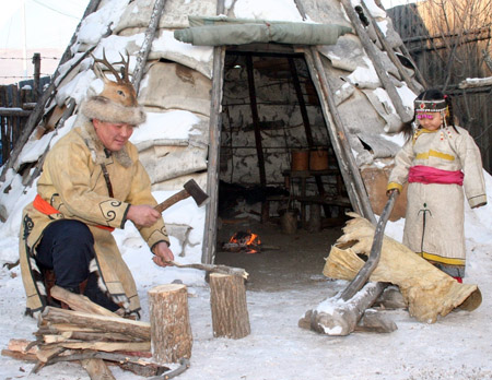 Photo taken on Dec. 28, 2008 shows traditional Oroqen houses in Oroqen ethnic autonomous county in north China's Inner Mongolia Autonomous Region. [Zhou Ning/Xinhua]