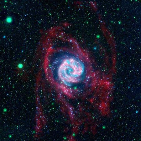 An image released by NASA in April shows baby stars taking shape in the Southern Pinwheel galaxy. Embryonic stars were found to be growing in the galaxy's spindly arms (shown in red), rather than in its bright heart. [Photo: NASA]