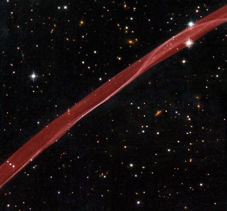 Like a ribbon trailing from a parade float, a streamer of hydrogen gas seems to waft across the stars in an image taken by the Hubble Space Telescope. Released in July, this festive shot of a supernova remnant was National Geographic News's tenth most viewed space photo of 2008. [Photo: NASA]