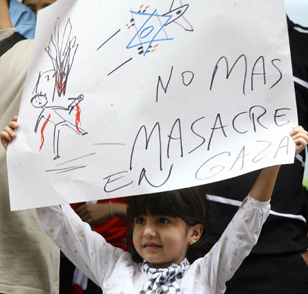 A Palestinian girl demonstrates in front of the Israeli Embassy in Caracas, capital of Venezuela, on Dec. 29, 2008. Palestinians who reside in Venezuela gathered here on Monday during a demonstration against Israeli airstrikes on the Gaza Strip. [Xinhua/Bolivar News Agency]