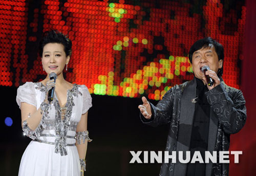Jackie Chan (right) and Tan Jing perform at a China Mobile awards ceremony at the Workers' Indoor Arena in Beijing to honor the year's most popular ring-tone music on December 28, 2008. 