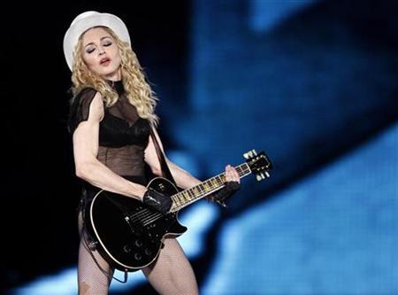 Madonna performs on stage during her 'Sticky and Sweet' tour at Monumental stadium in Buenos Aires, December 5, 2008.
