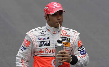 McLaren's Formula One driver Lewis Hamilton of Britain drinks before the Brazilian F1 Grand Prix in Sao Paulo November 2, 2008. 