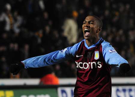 Aston Villa's Ashley Young celebrates after his cross led to a Hull City own goal during their English Premier League soccer match in Hull Dec. 30, 2008. 