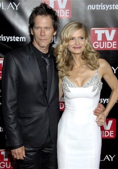 In this Sept. 21, 2008 file photo, actor Kevin Bacon, left, and his wife, actress Kyra Sedgwick pose on the press line at the TV Guide Emmy After Party in Los Angeles.